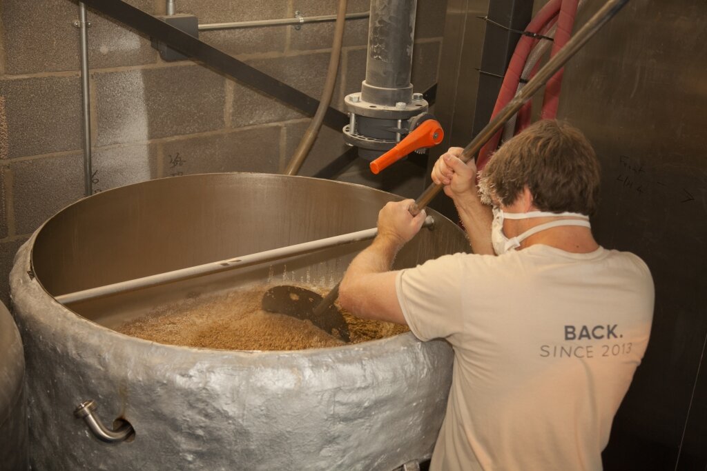 Head Brewer Mat mashing in a batch of Mane Event.